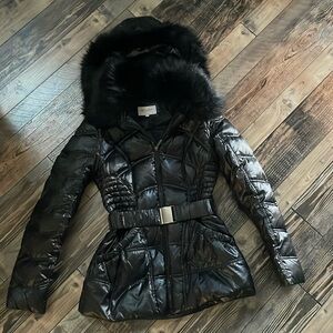 Black faux fur snow parka with detachable hood and belt